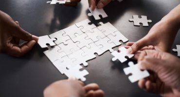 Picture of different people all providing a different piece of the overall career outcomes data.